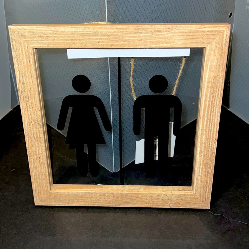 New Trueliving Man and Woman “Bathroom Symbol” Wall Plaque